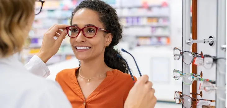 woman testing eyeglasses at the pharmacy